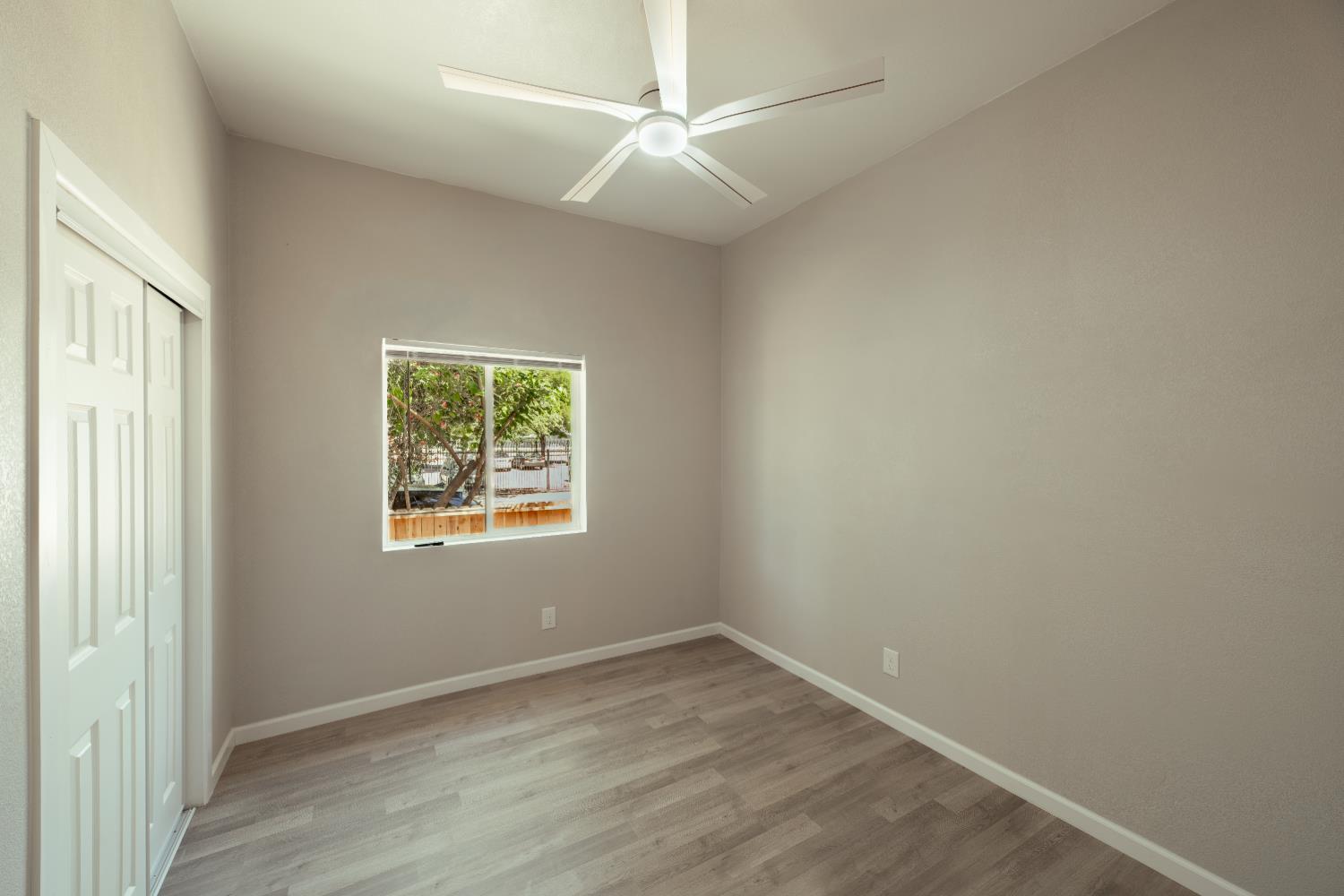 2320 K Street Merced, CA 95340 - Photo 8 of 25 an empty room with a window