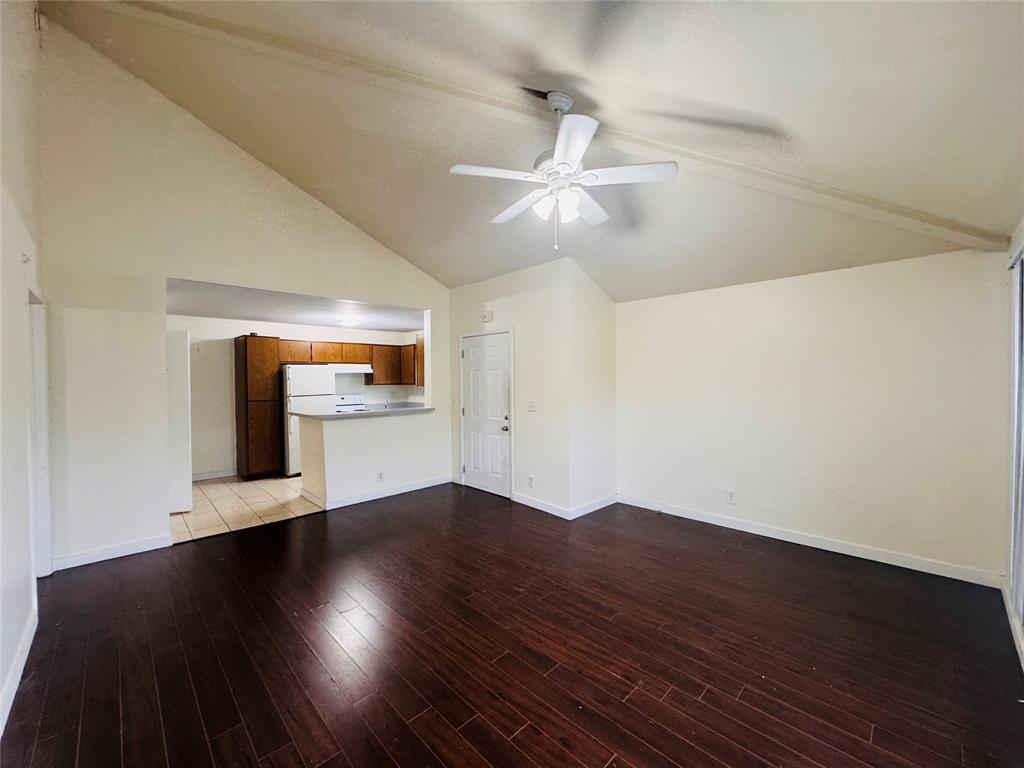 4090 North Pine Island Road, Unit 301 Sunrise, FL 33351 - Photo 5 of 16 wooden floor in an empty room with a window
