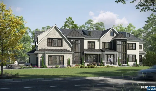 a front view of a residential houses with yard and green space