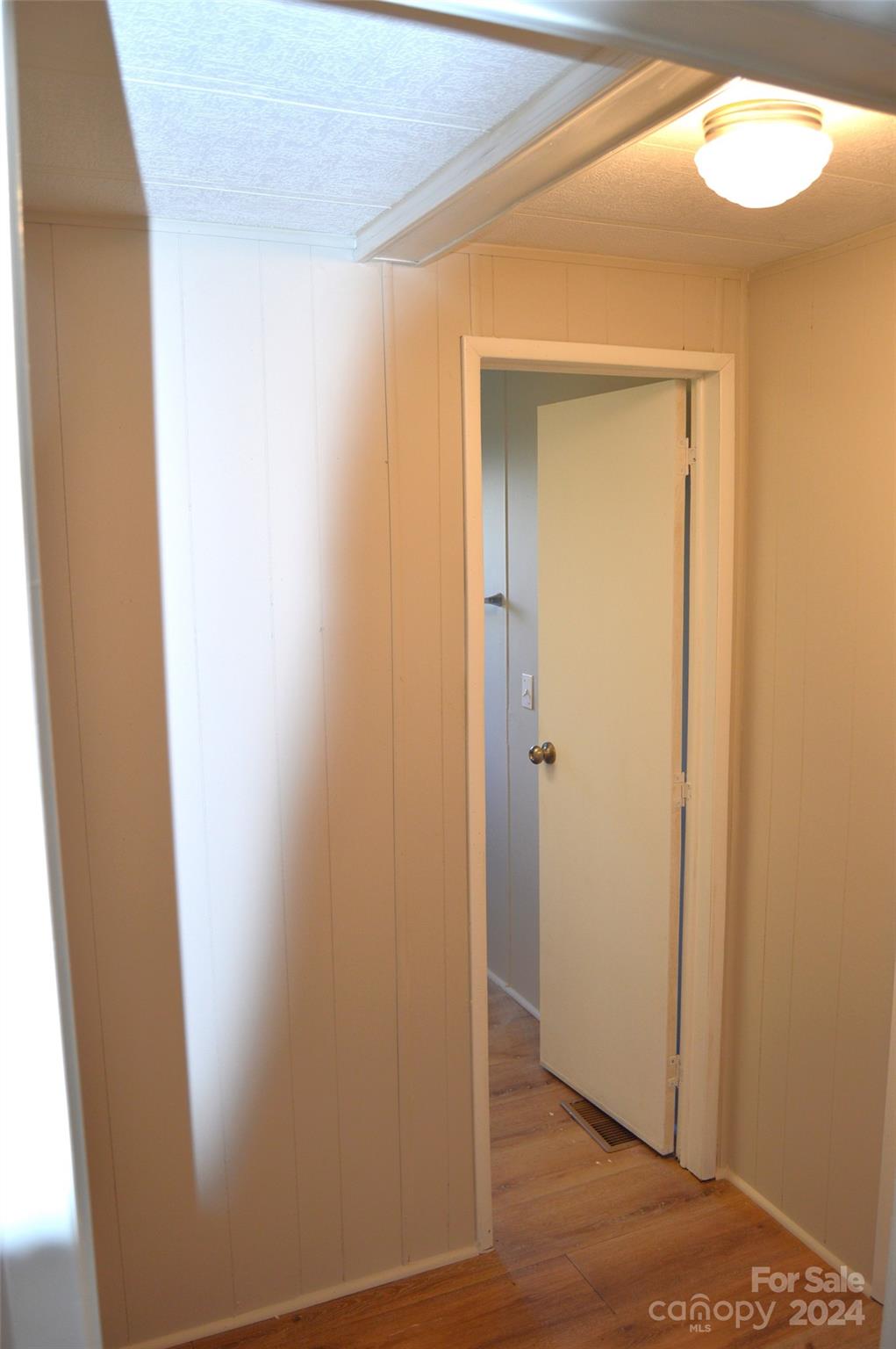 613 West Lewis Ferry Road Statesville, NC 28677 - Photo 16 of 22 a view of a hallway with wooden floor