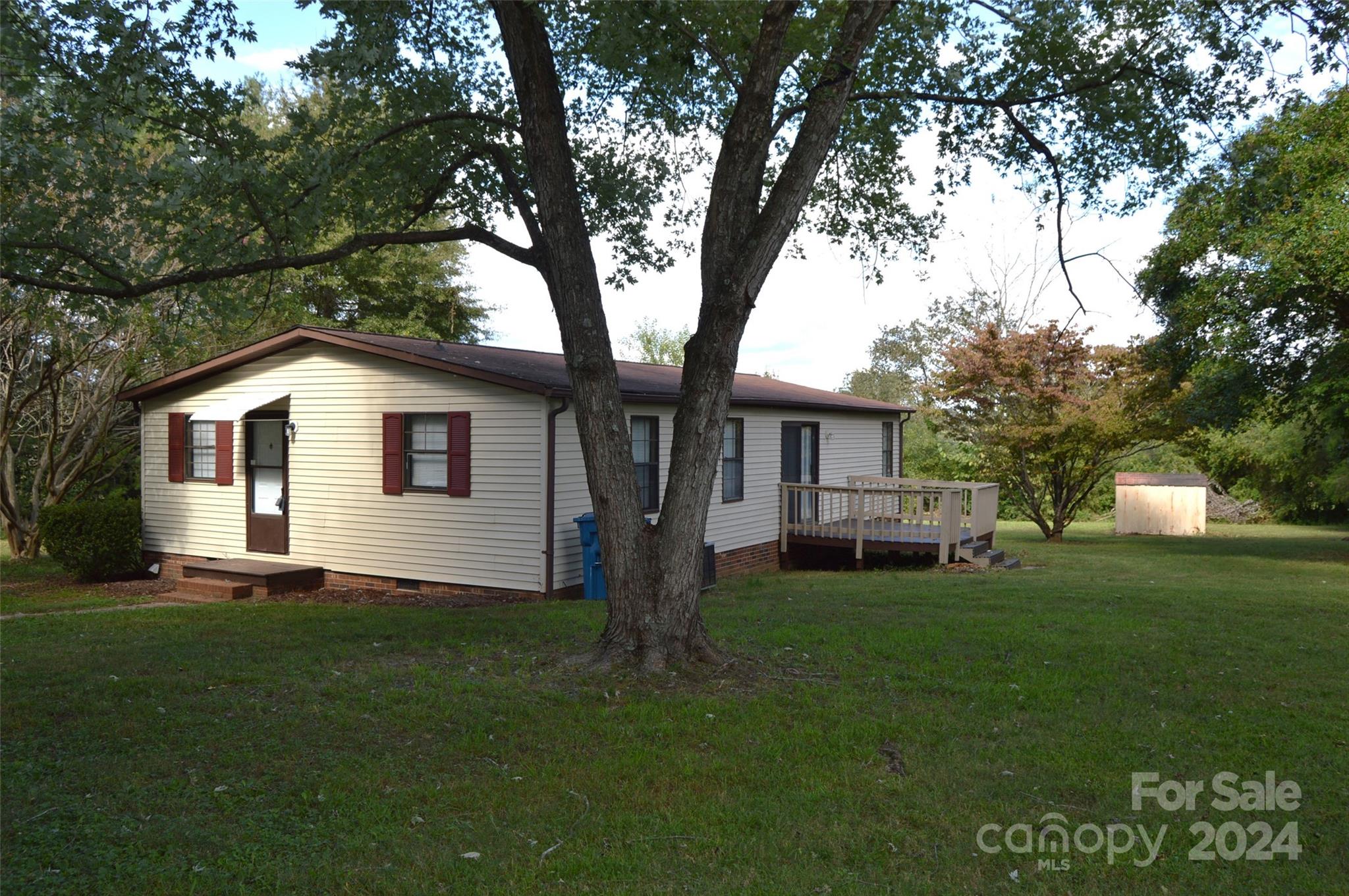 613 West Lewis Ferry Road Statesville, NC 28677 - Photo 20 of 22 a front view of house with yard and green space