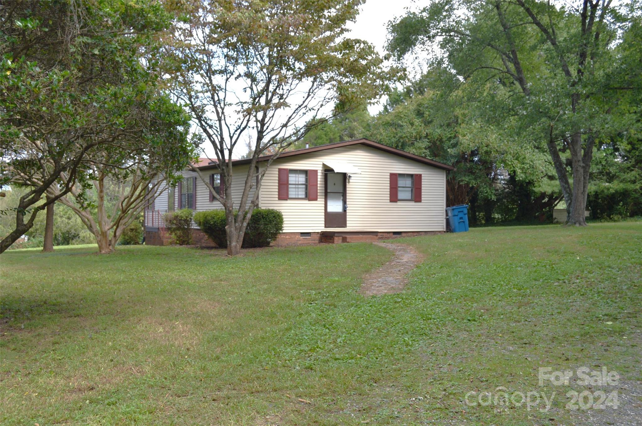 613 West Lewis Ferry Road Statesville, NC 28677 - Photo 2 of 22 a view of a house with a yard