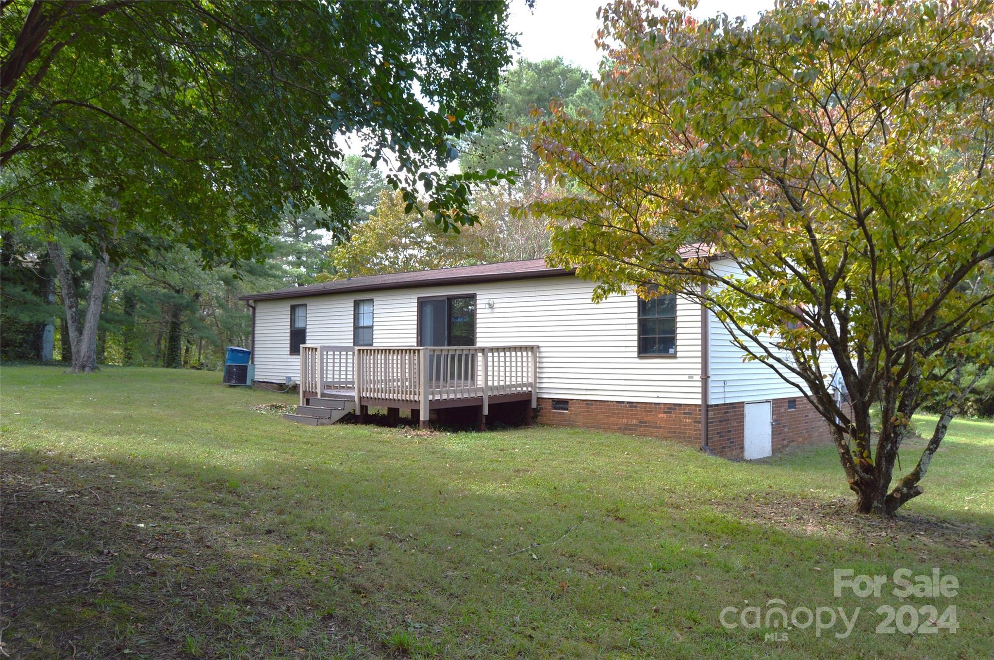 613 West Lewis Ferry Road Statesville, NC 28677 - Photo 4 of 22 a view of a house with a yard