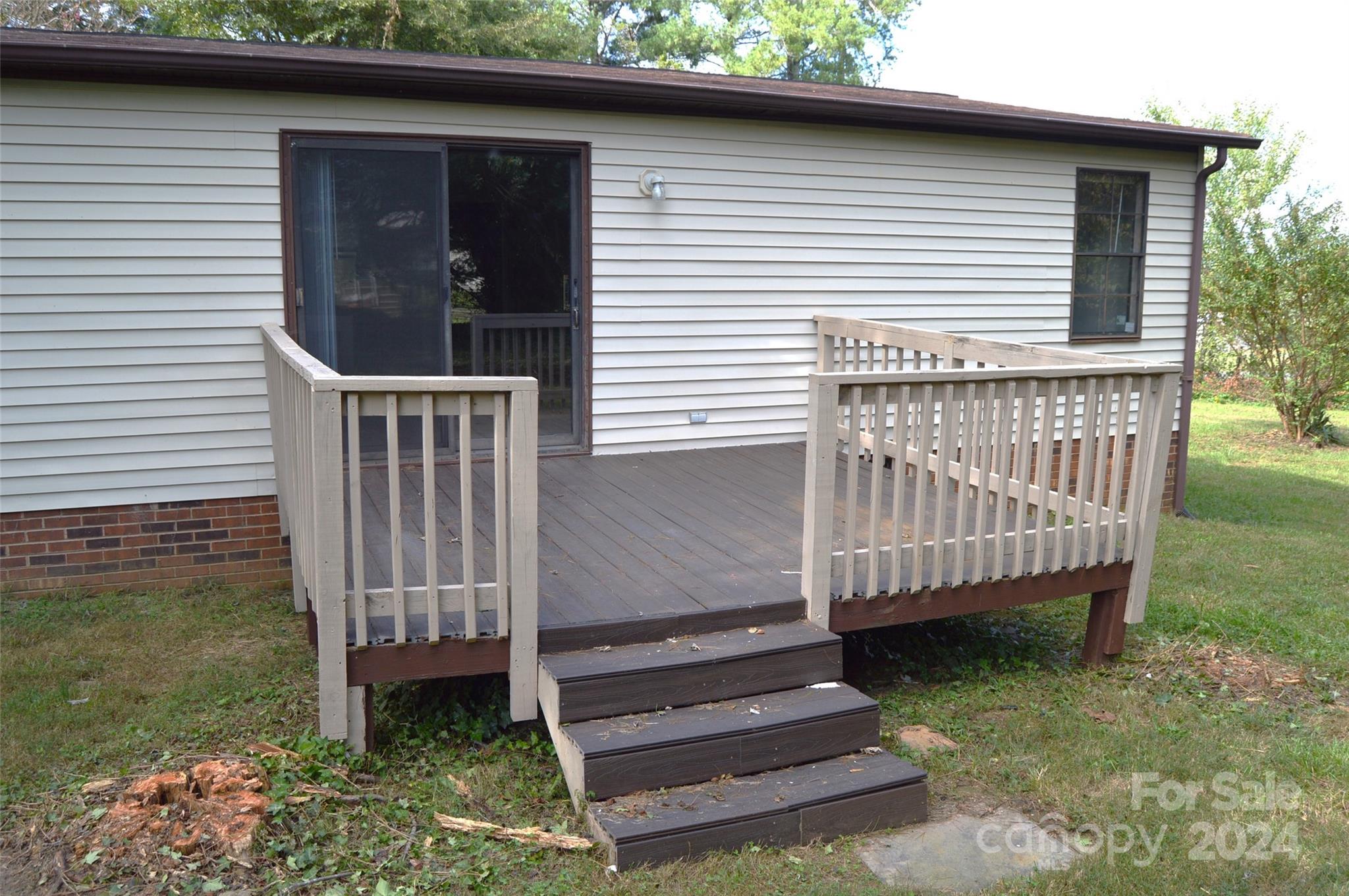 613 West Lewis Ferry Road Statesville, NC 28677 - Photo 5 of 22 a view of a small house with a yard
