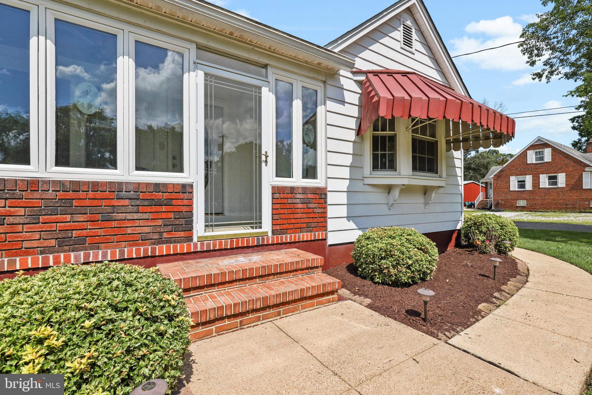 1058 Minnetonka Road Severn, MD 21144 - Photo 5 of 96 welcoming 3-season enclosed front porch