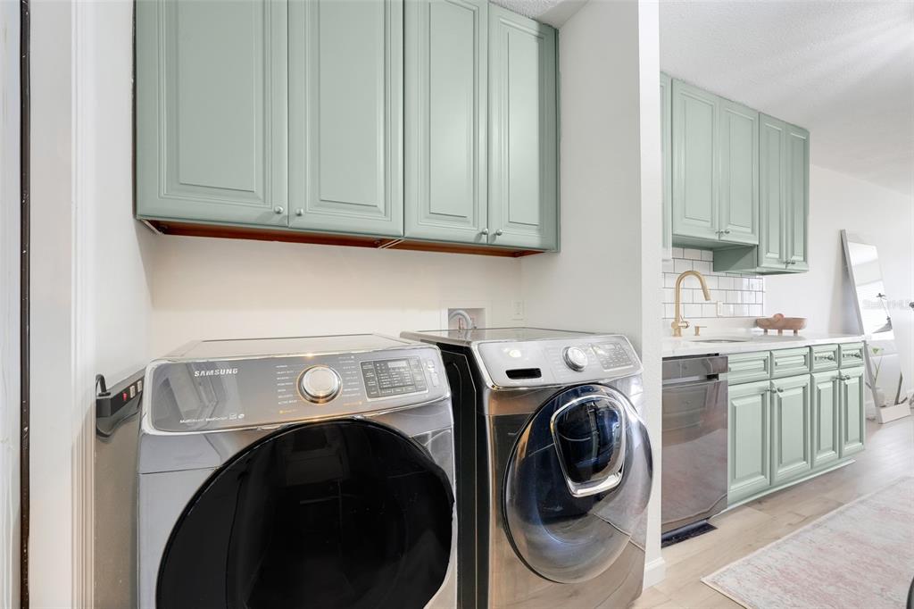30024 Tavares Ridge Boulevard, Unit 62 Tavares, FL 32778 - Photo 13 of 31 a utility room with dryer and washer