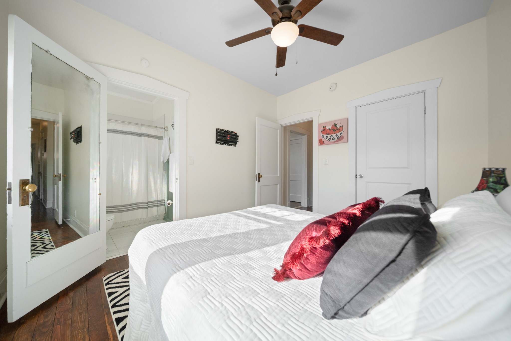 610 5th Avenue West Springfield, TN 37172 - Photo 18 of 45 a bedroom with a bed and a chandelier