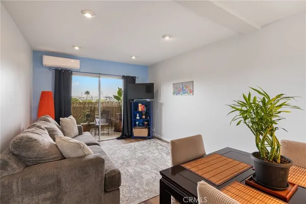 a living room with furniture flowerpot and a potted plant