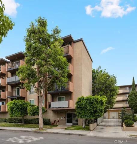 a swimming pool with outdoor seating and trees