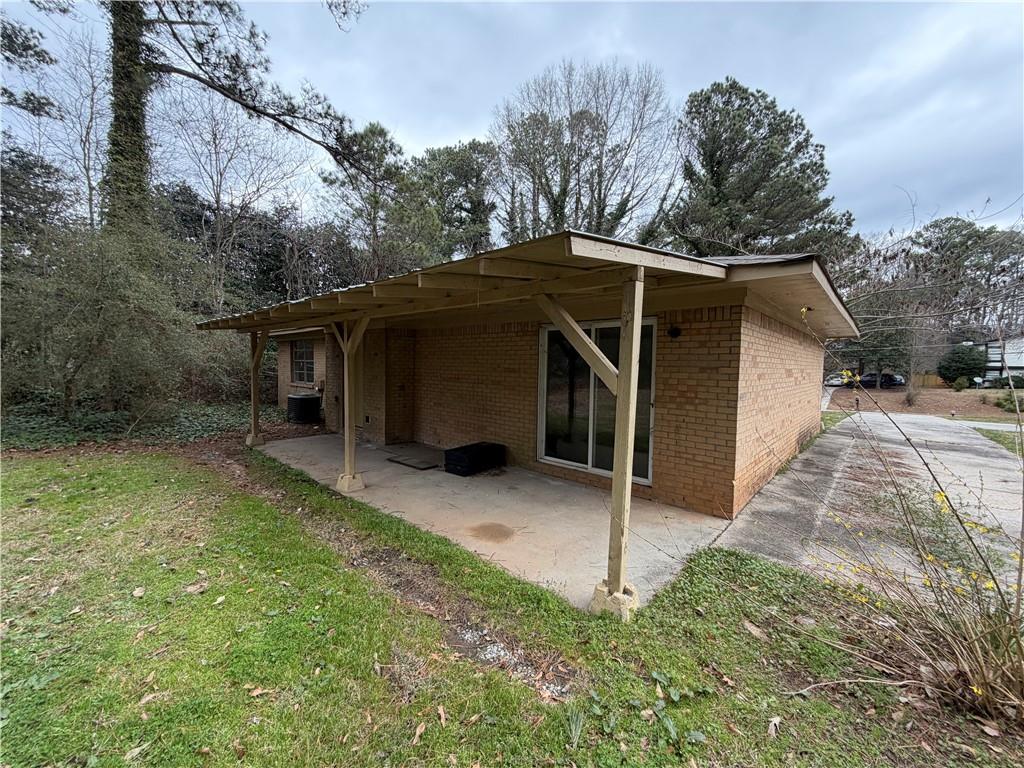 1765 Highpoint Road Snellville, GA 30078 - Photo 3 of 11 a view of a house with a yard