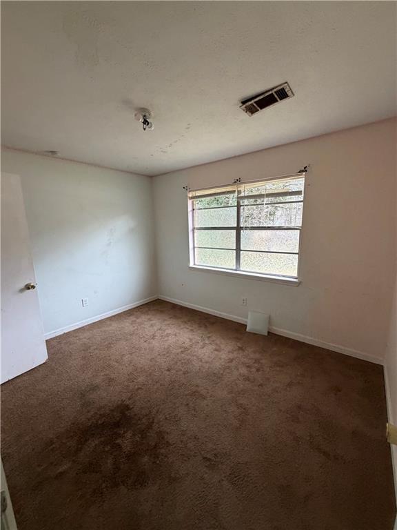 1765 Highpoint Road Snellville, GA 30078 - Photo 5 of 11 en empty room with windows