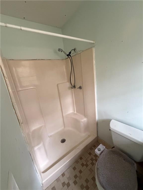 1765 Highpoint Road Snellville, GA 30078 - Photo 6 of 11 a bathroom with a toilet and a shower