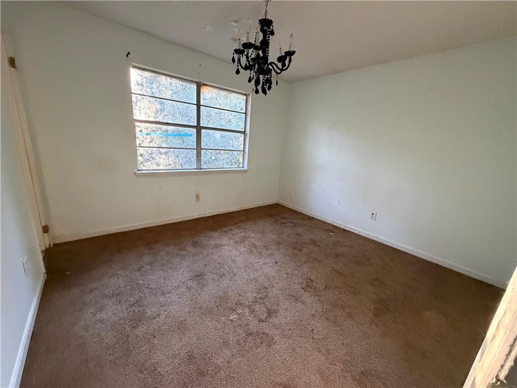 1765 Highpoint Road Snellville, GA 30078 - Photo 10 of 11 an empty room with a window