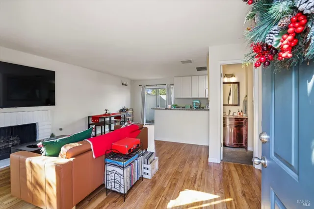 a living room with furniture fireplace and flat screen tv