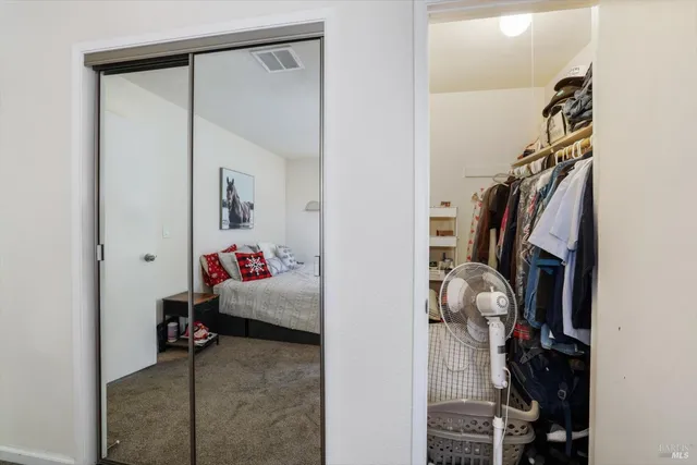 a view of a workspace with a window and a flat screen tv