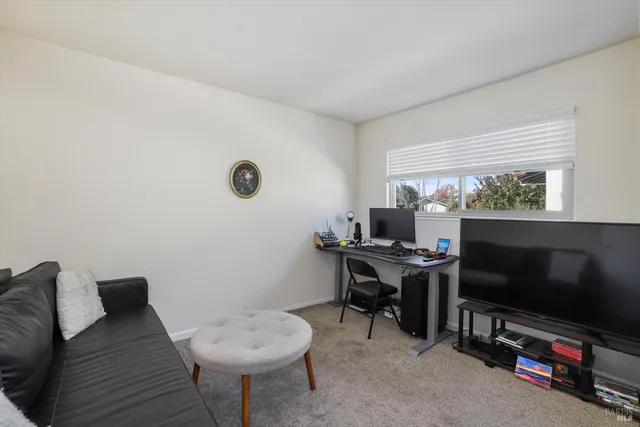 a room with furniture and a flat screen tv