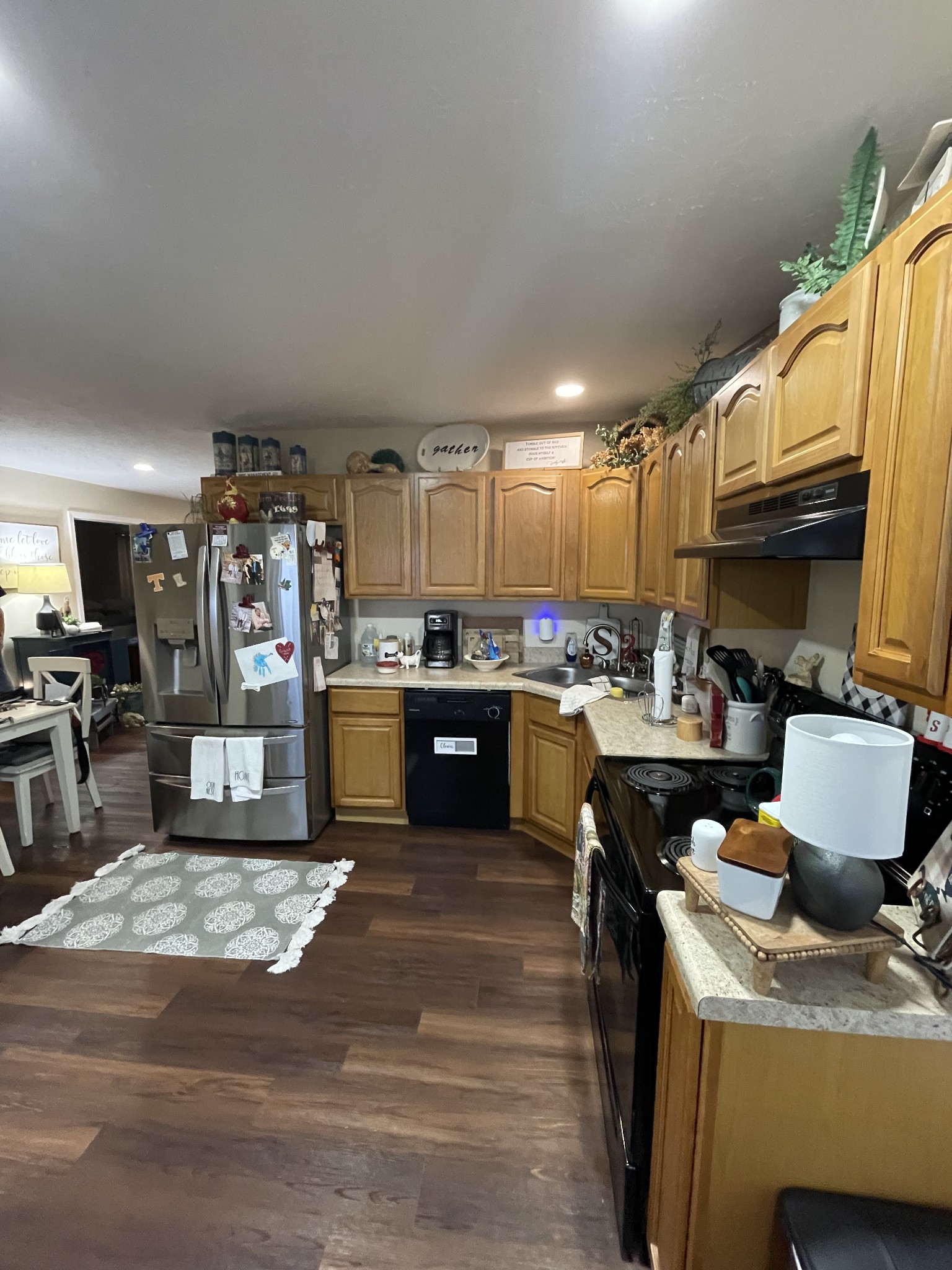 914 Freeman Street Lafayette, TN 37083 - Photo 6 of 12 a kitchen with stainless steel appliances kitchen island granite countertop a stove refrigerator and cabinets
