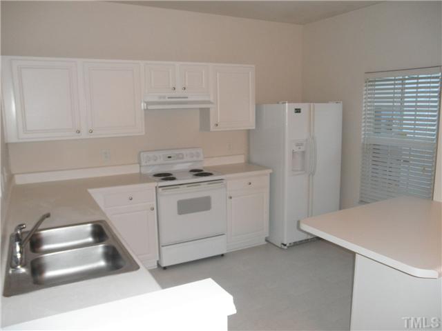 5205 Echo Ridge Road Raleigh, NC 27612 - Photo 4 of 10 a utility room with cabinets washer and dryer