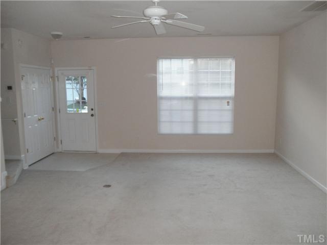 5205 Echo Ridge Road Raleigh, NC 27612 - Photo 5 of 10 an empty room with windows and closet
