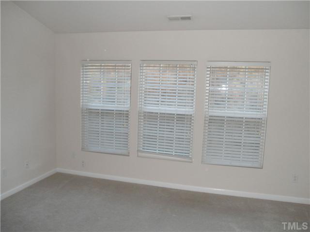 5205 Echo Ridge Road Raleigh, NC 27612 - Photo 7 of 10 a view of empty room with window