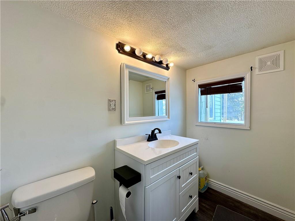 3758 Ellwood Road New Castle, PA 16101 - Photo 11 of 33 a bathroom with a sink a toilet and mirror