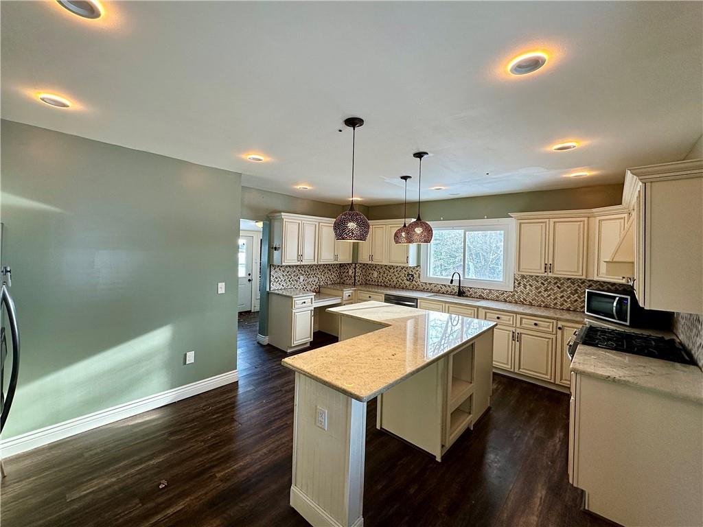 3758 Ellwood Road New Castle, PA 16101 - Photo 12 of 33 a kitchen with a sink a counter top space stainless steel appliances and cabinets