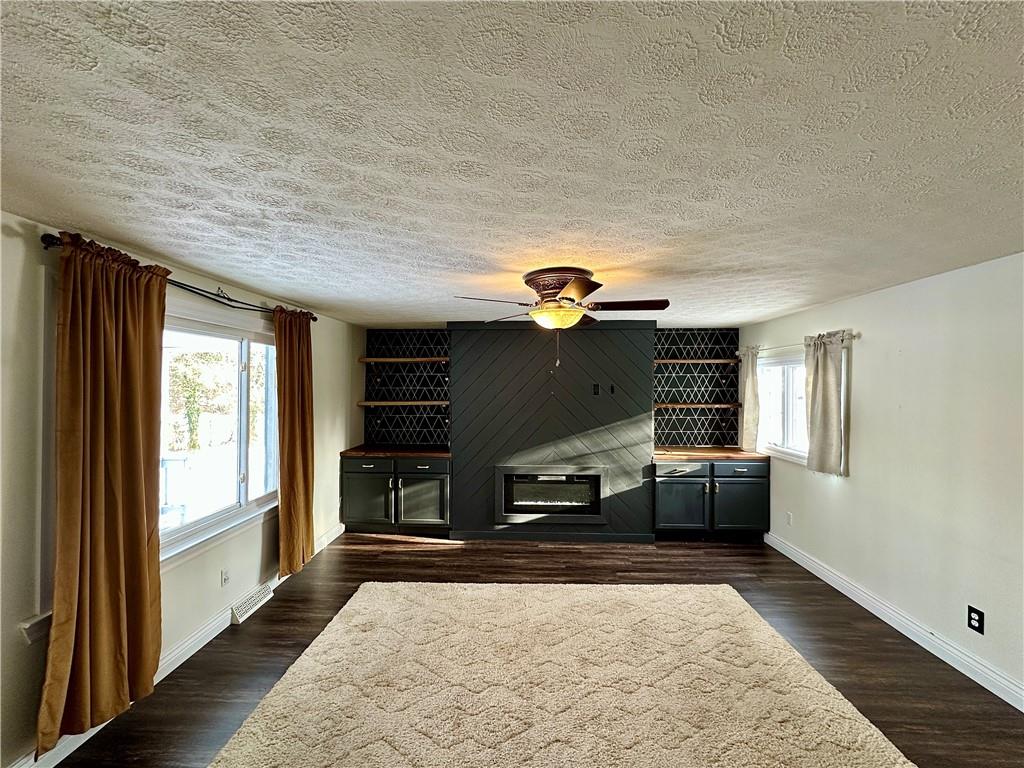 3758 Ellwood Road New Castle, PA 16101 - Photo 16 of 33 a living room with furniture fireplace and a window