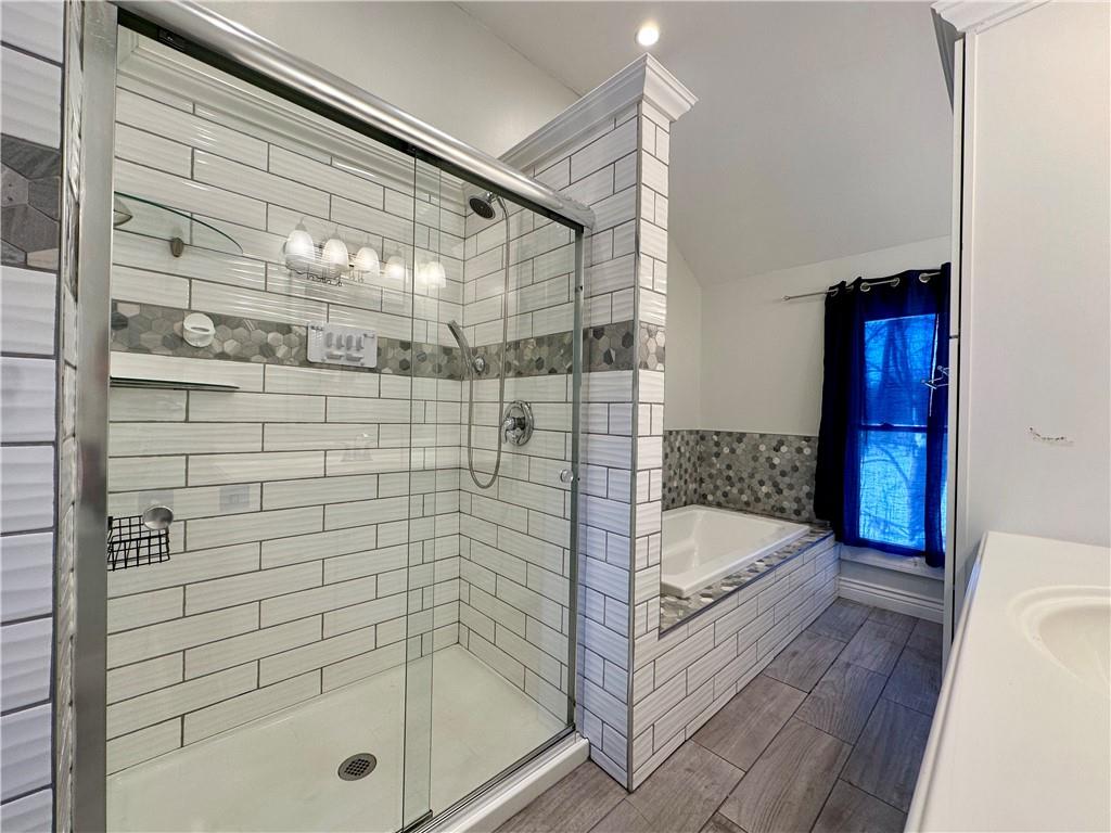 3758 Ellwood Road New Castle, PA 16101 - Photo 21 of 33 a bathroom with a tub and shower