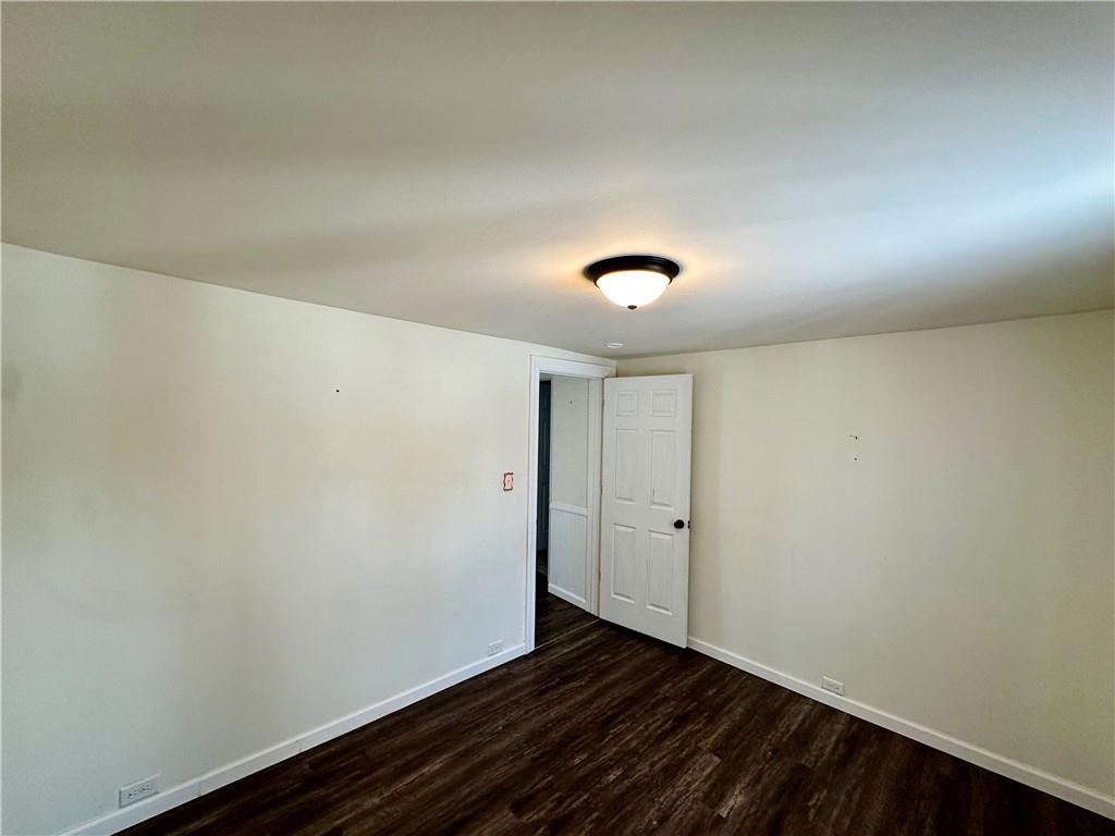3758 Ellwood Road New Castle, PA 16101 - Photo 26 of 33 an empty room with wooden floor