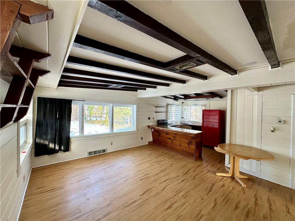 3758 Ellwood Road New Castle, PA 16101 - Photo 29 of 33 a view of an empty room with wooden floor and windows