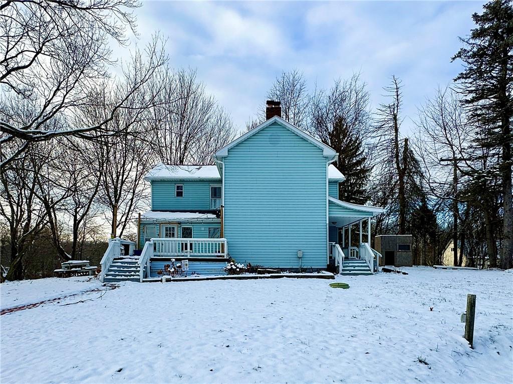 3758 Ellwood Road New Castle, PA 16101 - Photo 3 of 33 a front view of a house with a yard and garage