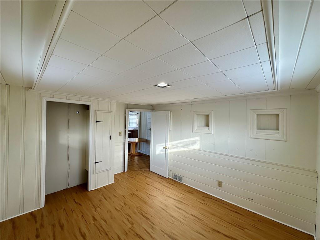 3758 Ellwood Road New Castle, PA 16101 - Photo 31 of 33 a view of empty room with wooden floor