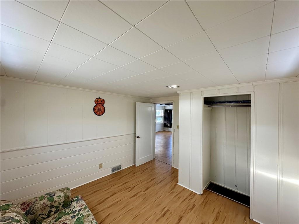 3758 Ellwood Road New Castle, PA 16101 - Photo 32 of 33 a view of empty room with wooden floor