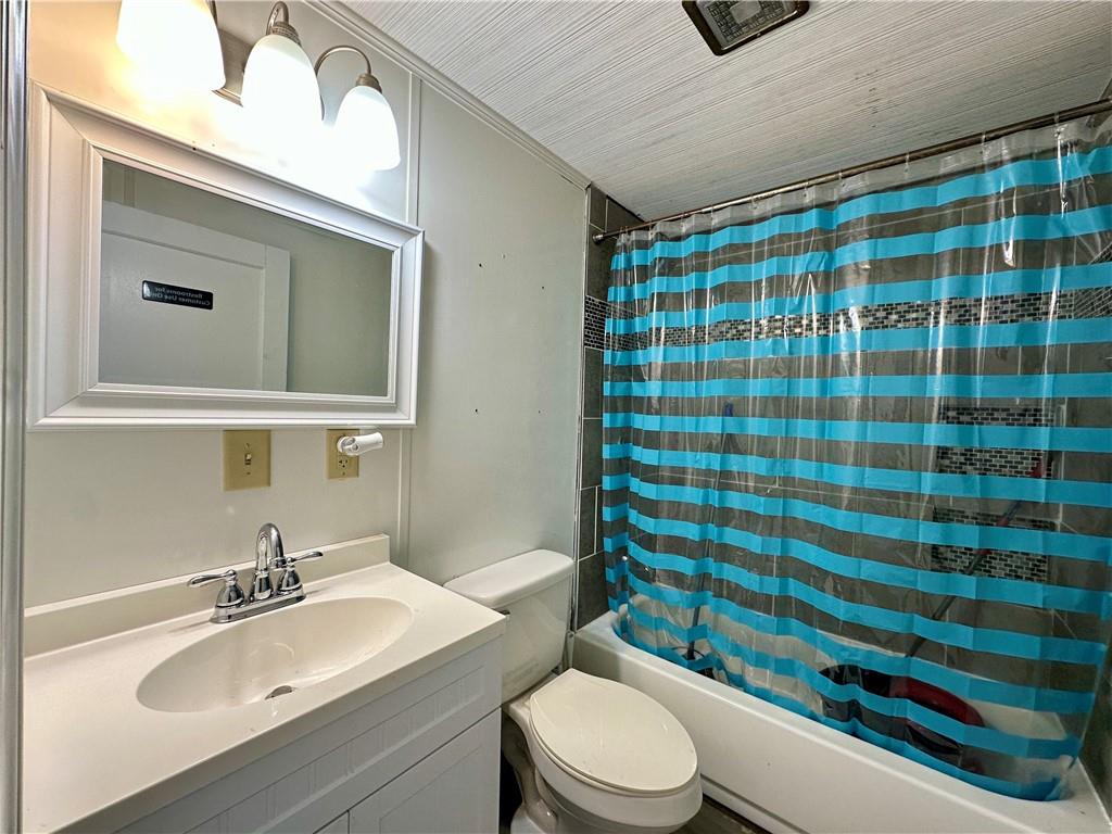 3758 Ellwood Road New Castle, PA 16101 - Photo 33 of 33 a bathroom with a sink a toilet and shower