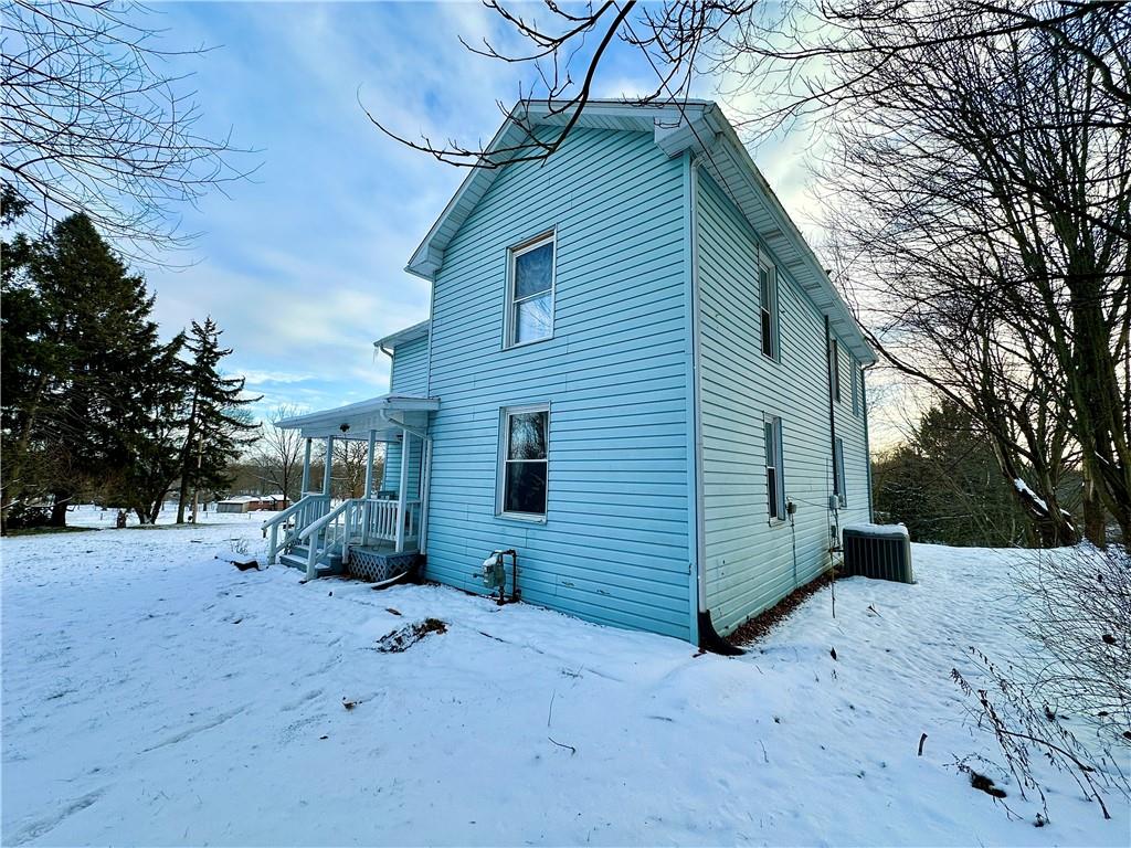 3758 Ellwood Road New Castle, PA 16101 - Photo 4 of 33 a backyard of a house with a large tree and wooden fence