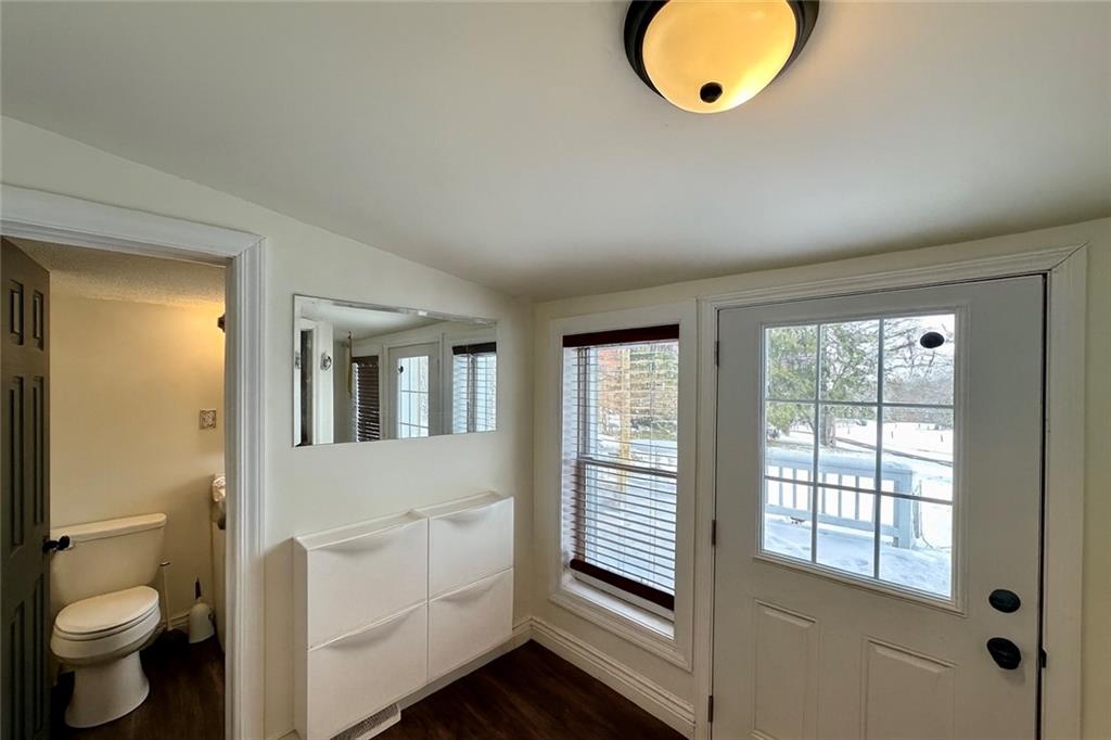 3758 Ellwood Road New Castle, PA 16101 - Photo 10 of 33 a bathroom with a toilet a sink and a mirror