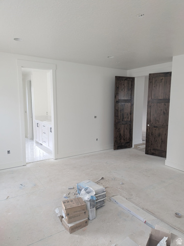 2771 West Aurora Avenue Mapleton, UT 84664 - Photo 16 of 39 New construction interior featuring white walls, recessed ceiling lighting, and rich wood-paneled doors