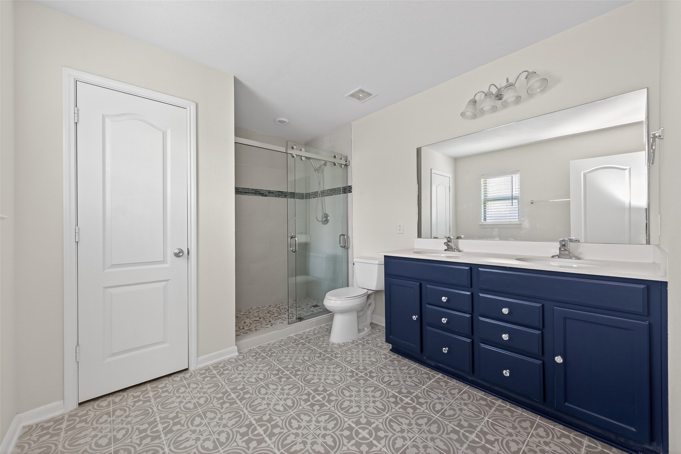 2754 Cayden Creek Way Conroe, TX 77304 - Photo 26 of 40 a bathroom with a granite countertop toilet a sink and a mirror