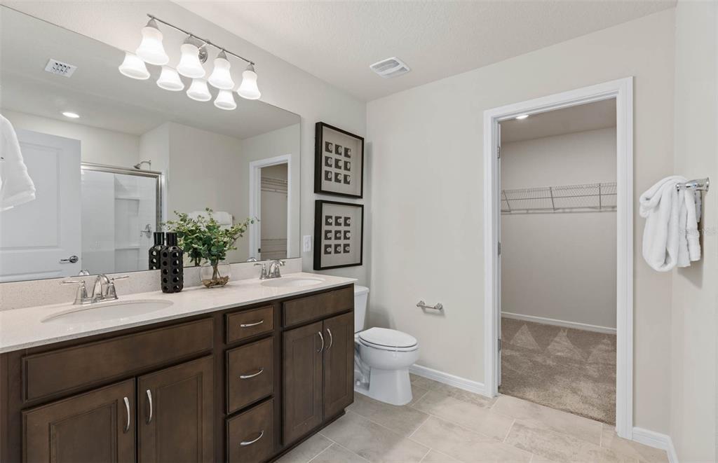 1452 Hamilton Way Lake Alfred, FL 33850 - Photo 6 of 24 a bathroom with a toilet sink and mirror