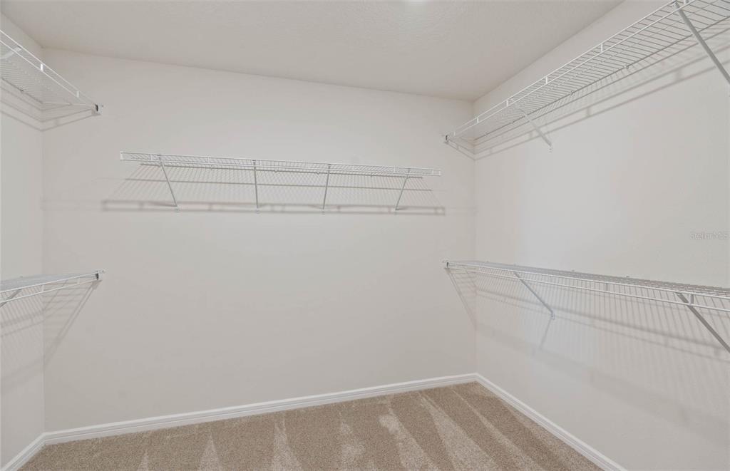 1452 Hamilton Way Lake Alfred, FL 33850 - Photo 7 of 24 a view of a room with racks on the wall