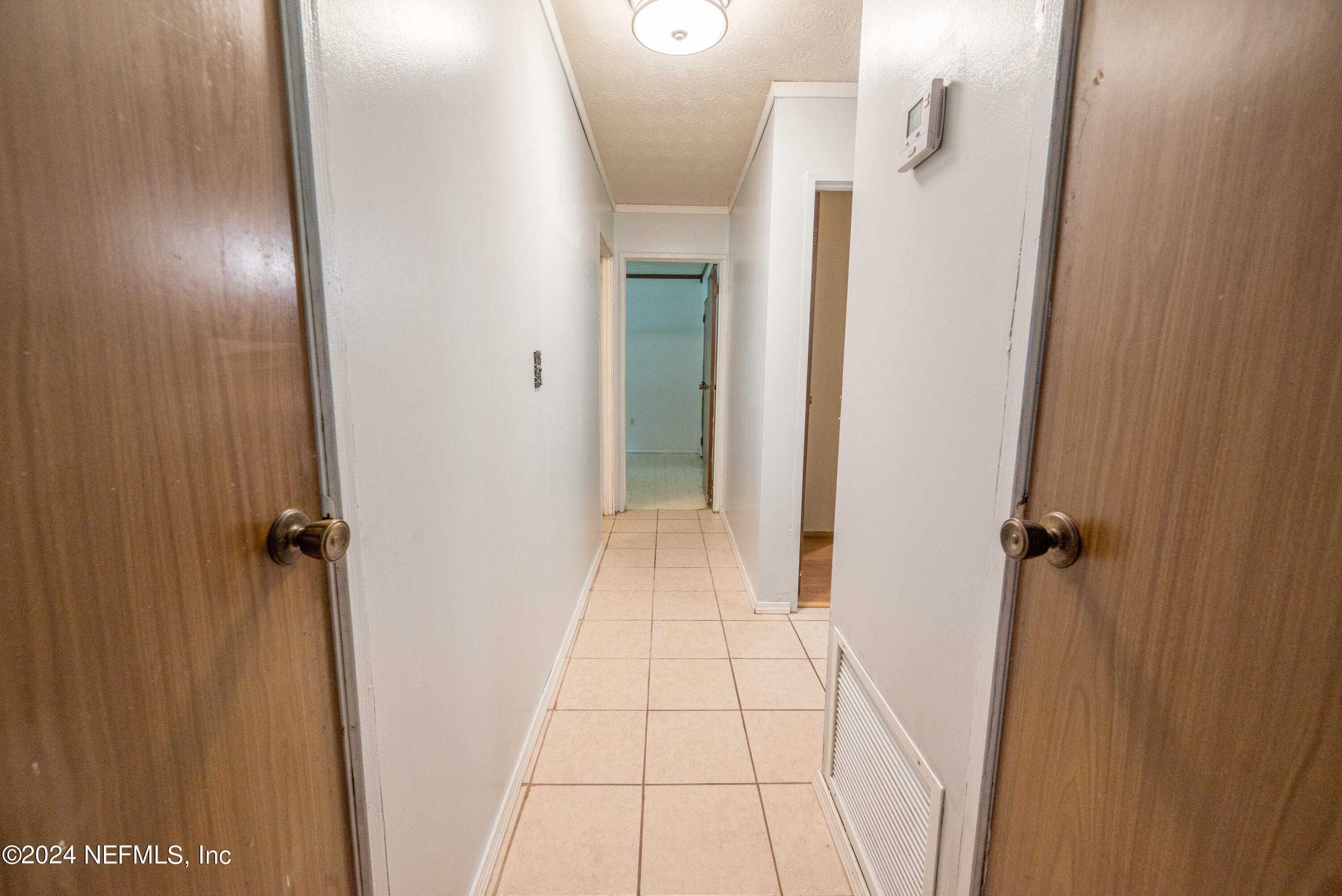 609 Collins Place Starke, FL 32091 - Photo 13 of 26 wooden floor in a gallery
