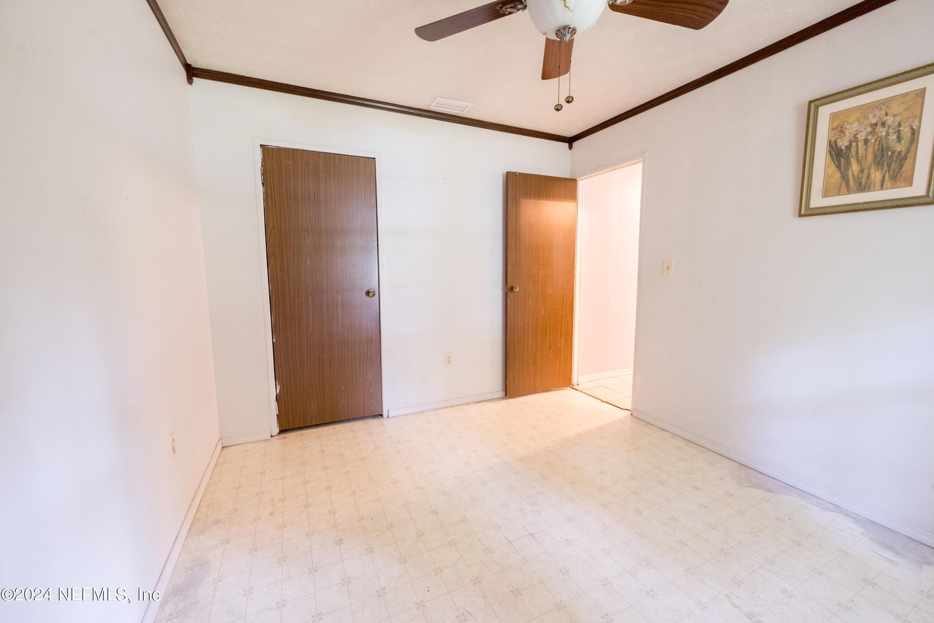609 Collins Place Starke, FL 32091 - Photo 16 of 26 a view of empty room with a ceiling fan