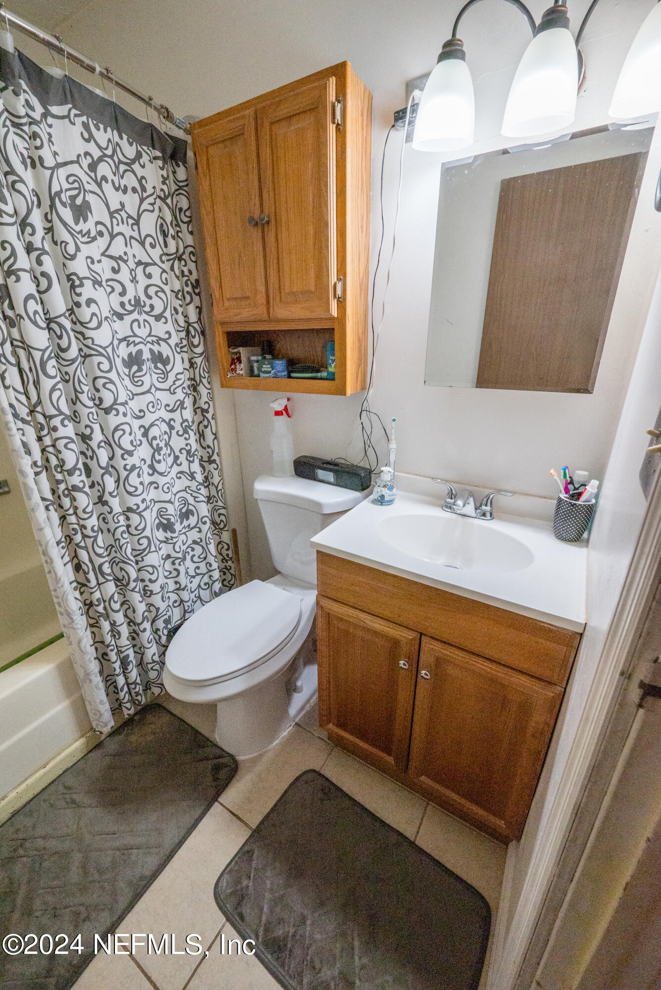 609 Collins Place Starke, FL 32091 - Photo 19 of 26 a bathroom with a sink toilet and shower