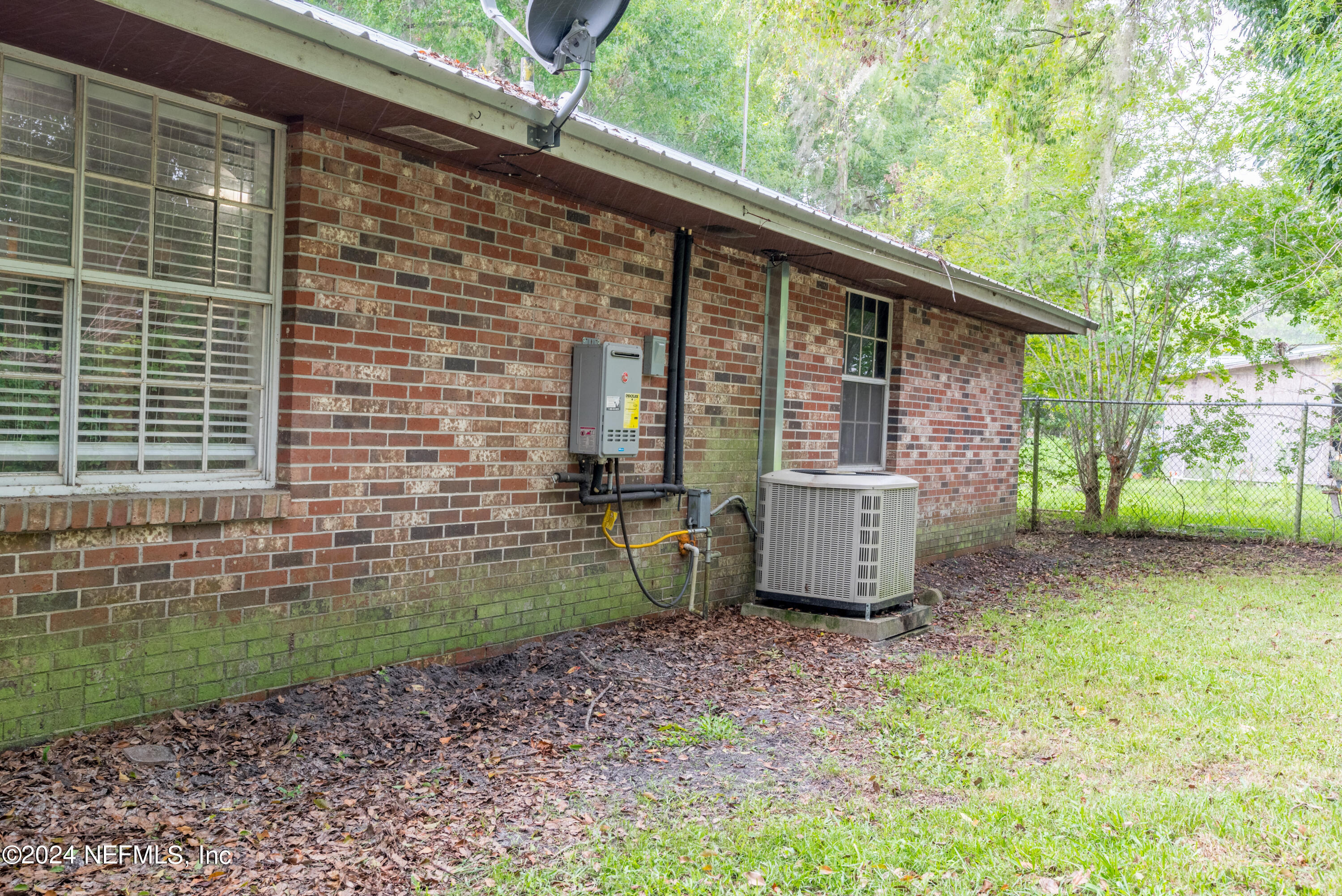 609 Collins Place Starke, FL 32091 - Photo 24 of 26 a view of a backyard with a garden