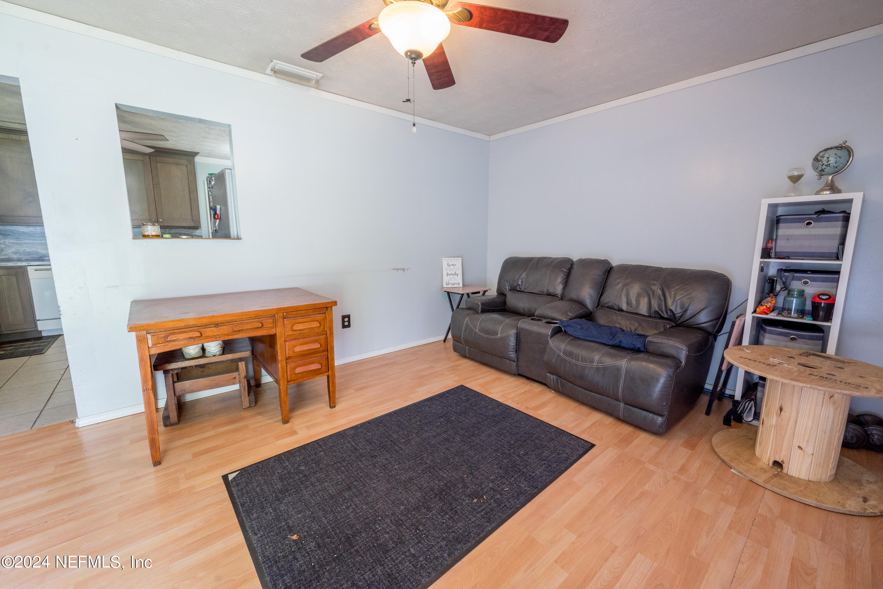 609 Collins Place Starke, FL 32091 - Photo 7 of 26 a living room with furniture and a couch