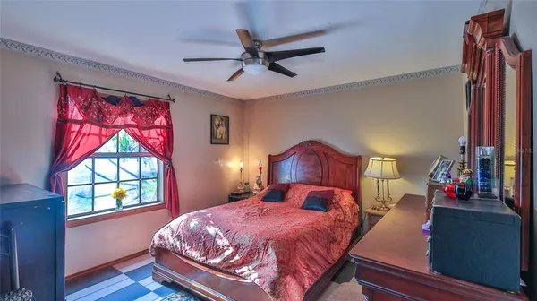 a bedroom with bed and a window