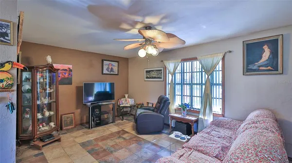 a dining room with furniture and window
