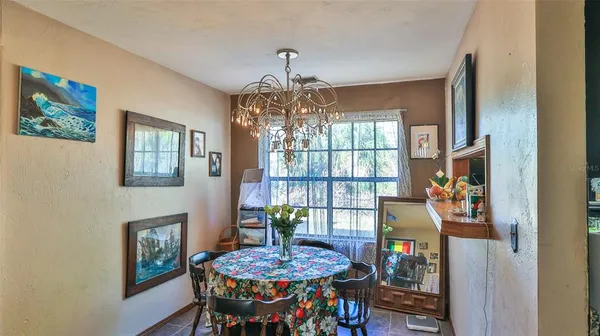 a bedroom with furniture and a chandelier