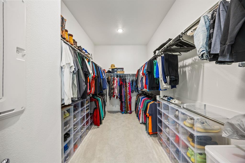 1807 Gateway Lane Van Alstyne, TX 75495 - Photo 20 of 33 a view of walk in closet with clothes