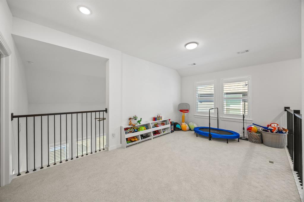 1807 Gateway Lane Van Alstyne, TX 75495 - Photo 23 of 33 a children room with toys and a couch